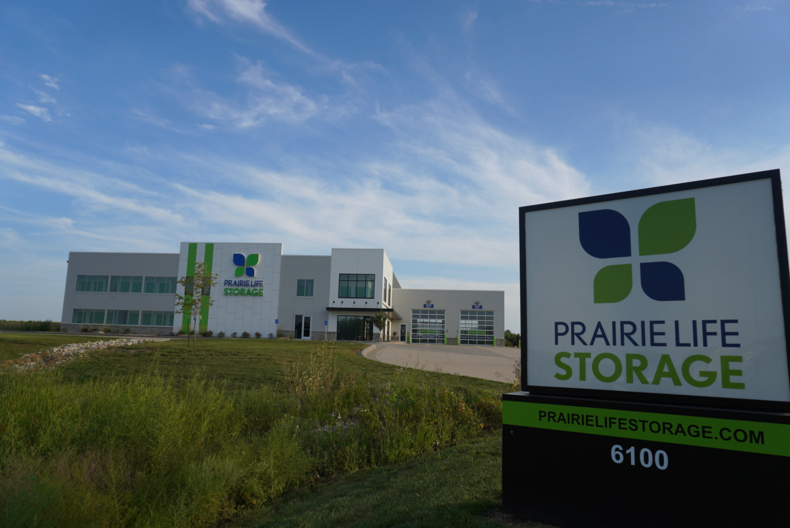 New - front facing photo w/ road signage 